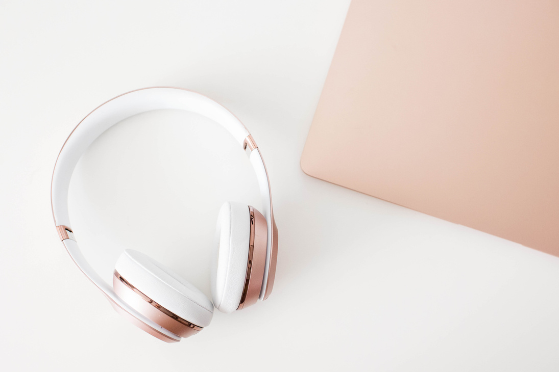 Wireless Headphones and Laptop for Podcasting